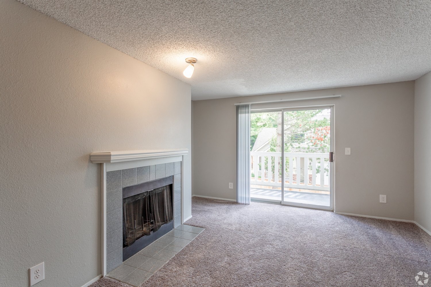 Living room with wood burning fireplace