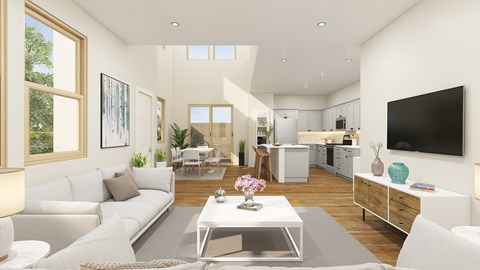 A modern living room with a white sofa and a coffee table in the center.