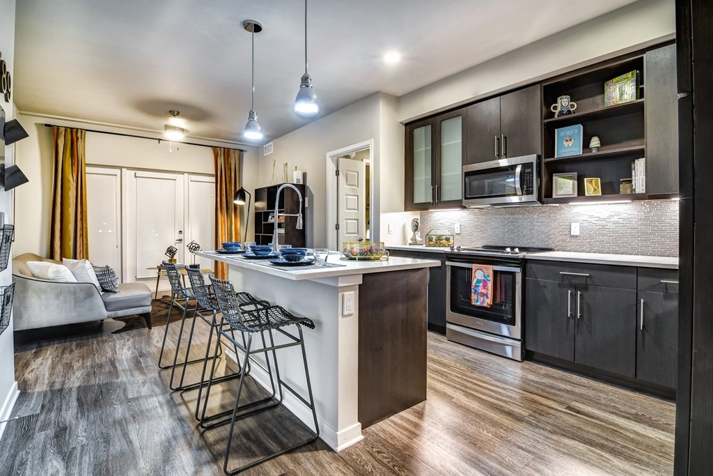 Juno at Winter Park apartments in Winter Park Florida photo of kitchen with custom pendant lighting