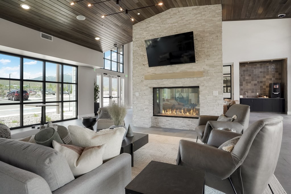 a living room with couches and a fireplace