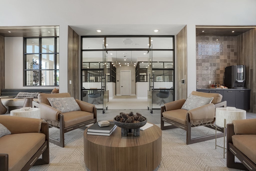 a living room with couches and chairs and a table