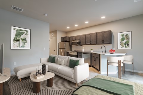 A modern living room with a white sofa and a coffee table.