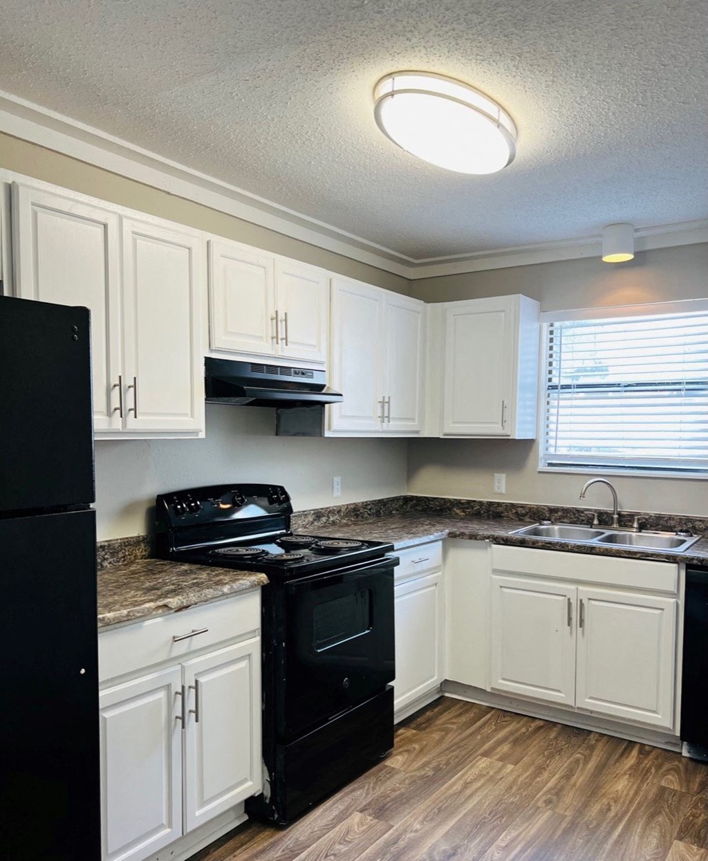 The Element at 4411 Macon, GA Apartment Black appliances Kitchen alternate view