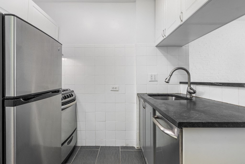a kitchen with stainless steel appliances and a sink