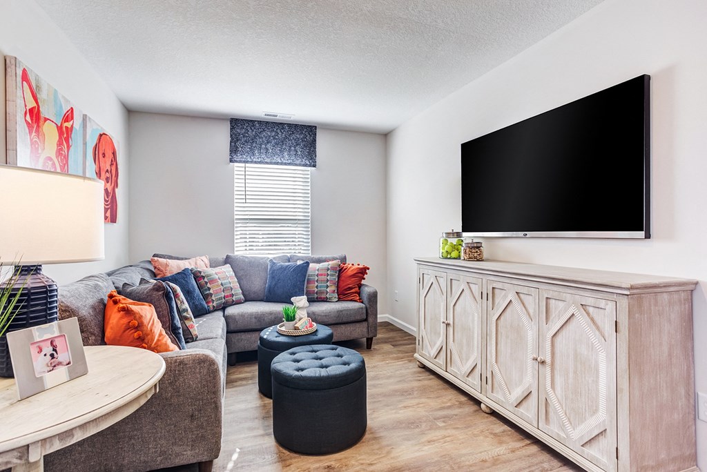 a living room with a couch and a tv