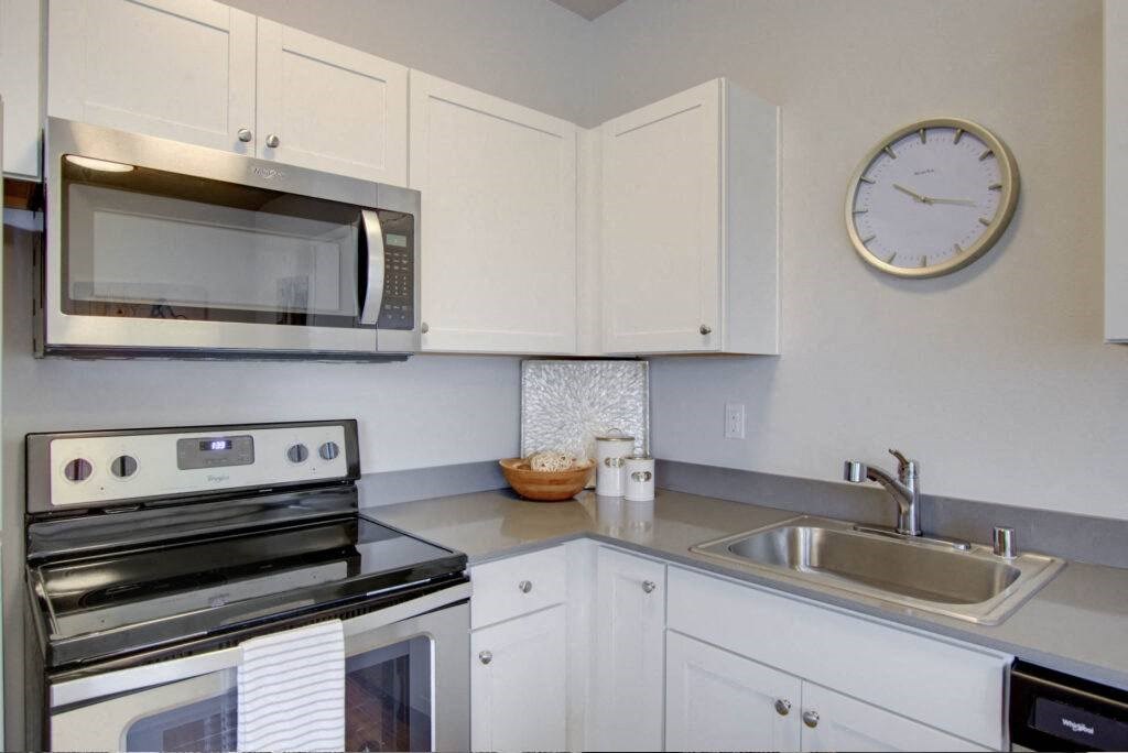 a kitchen with a microwave oven and a sink