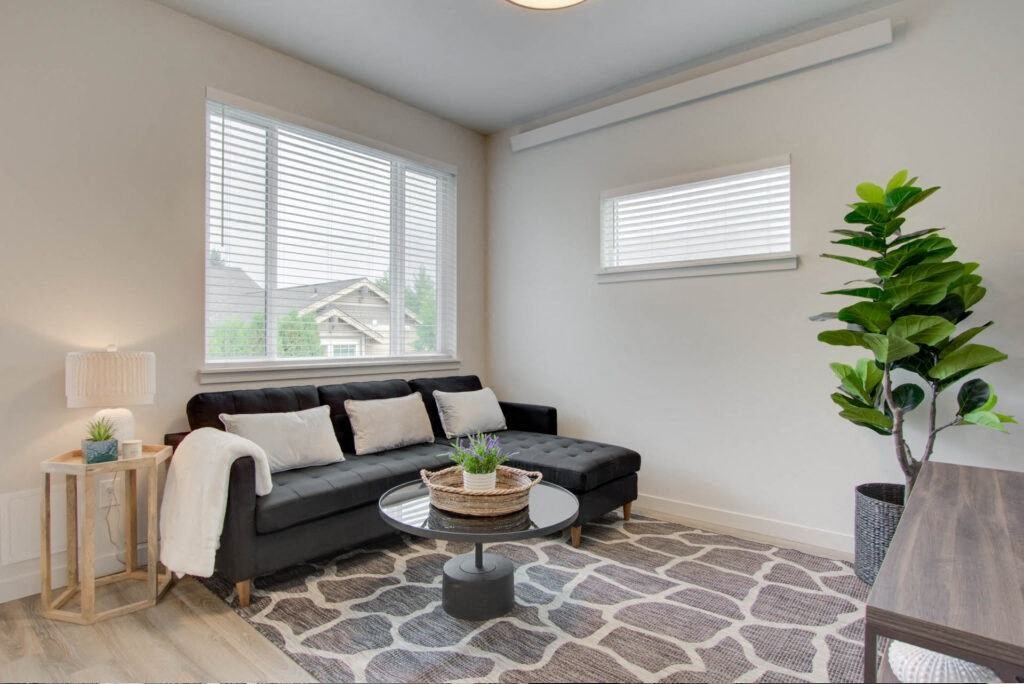 a living room with a couch and a table