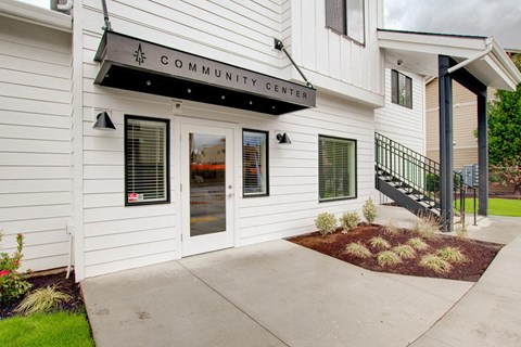 the front of the community center building with a ramp to the door