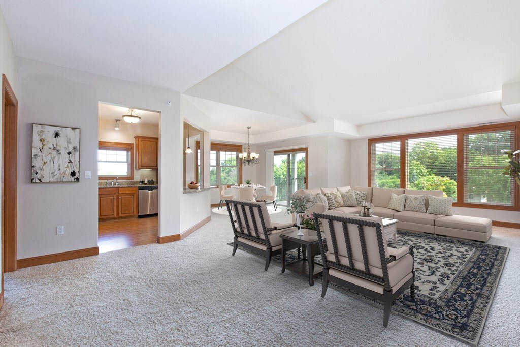 Laurel East End Apartments in Golden Valley, MN photo of a living room with a couch and a table and chairs