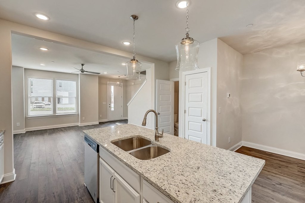 a kitchen with a sink and a counter top