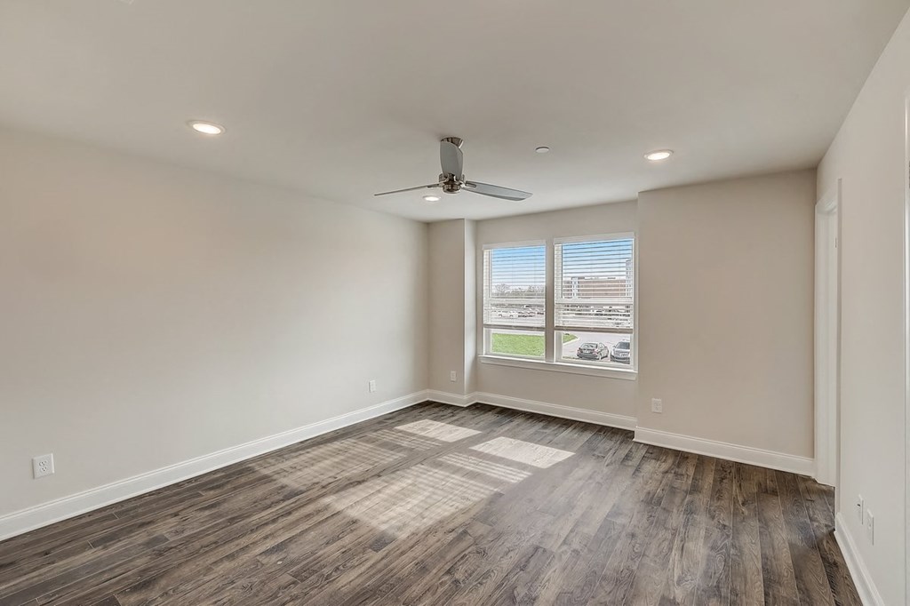 3 BR Townhomes in Gallatin TN - The Gardens at Preston Park - Unfurnished Bedroom with Hardwood Flooring, Window, and Celing Fan