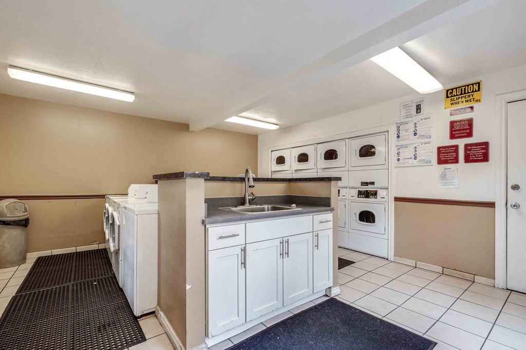 Fremont CA Apartments for Rent - Lincoln Glen - Community Laundry Center with Multiple Washer, Dryers, and a Sink