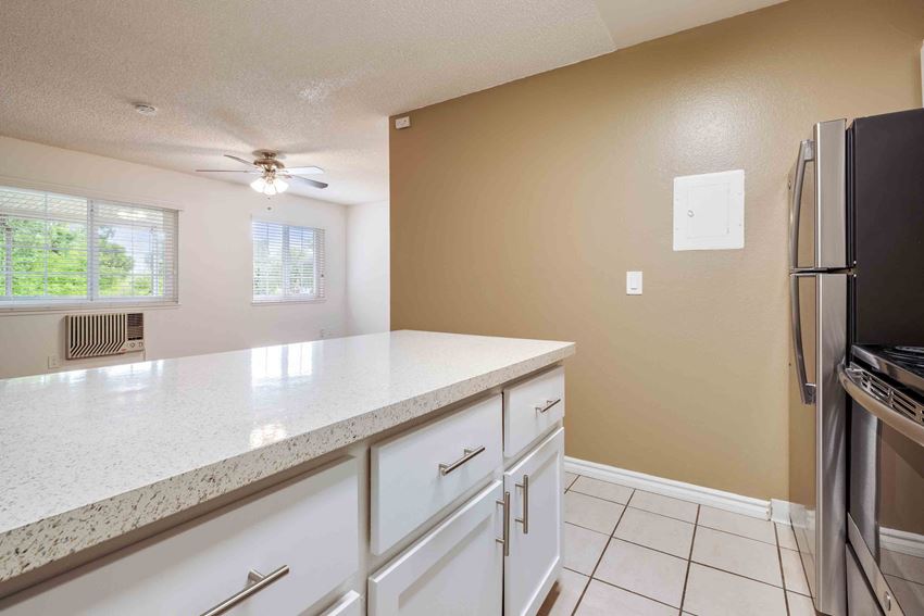 Apartments for Rent Fremont CA - Lincoln Glen - Bright Kitchen with Island, White Cabinets, and Stainless Appliances