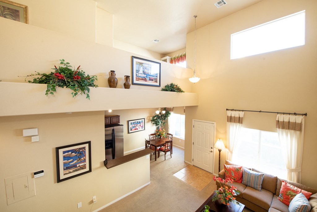 the view of a living room and dining room from above