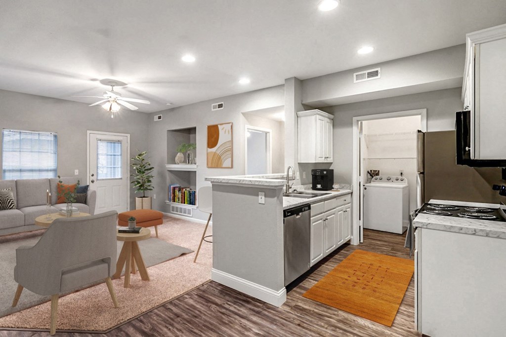 a living room with a kitchen and a dining room