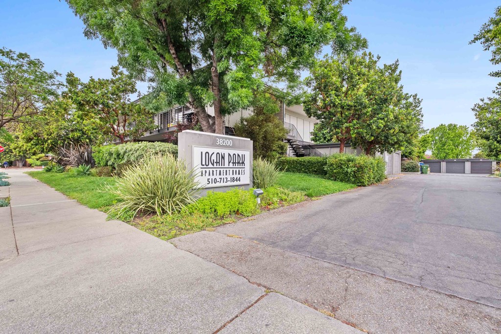 Apartments for Rent in Fremont, CA - Logan Park - Exterior View of Logan Park Apartment Building with Lush Landscaping.