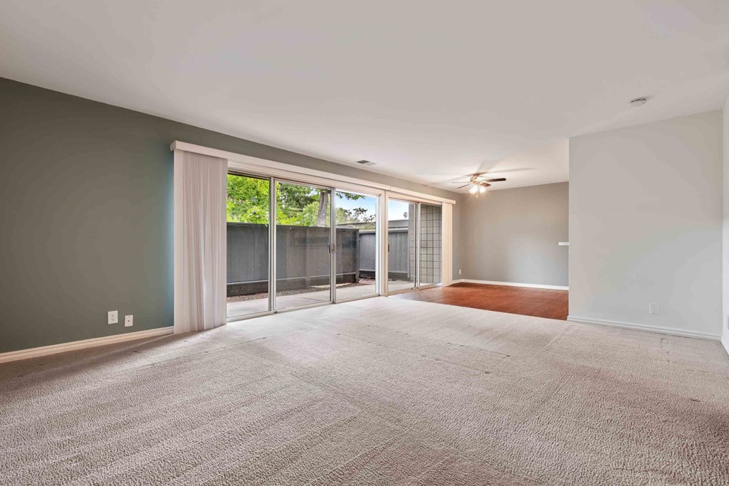 Apartments for Rent Fremont CA - Logan Park - Huge Empty Living Room with Carpet and Sliding Glass Door to Patio