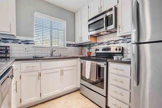 Townhomes in San Jose CA - Los Gatos Creek - Modern Kitchen with White Cabinets and Stainless Appliances