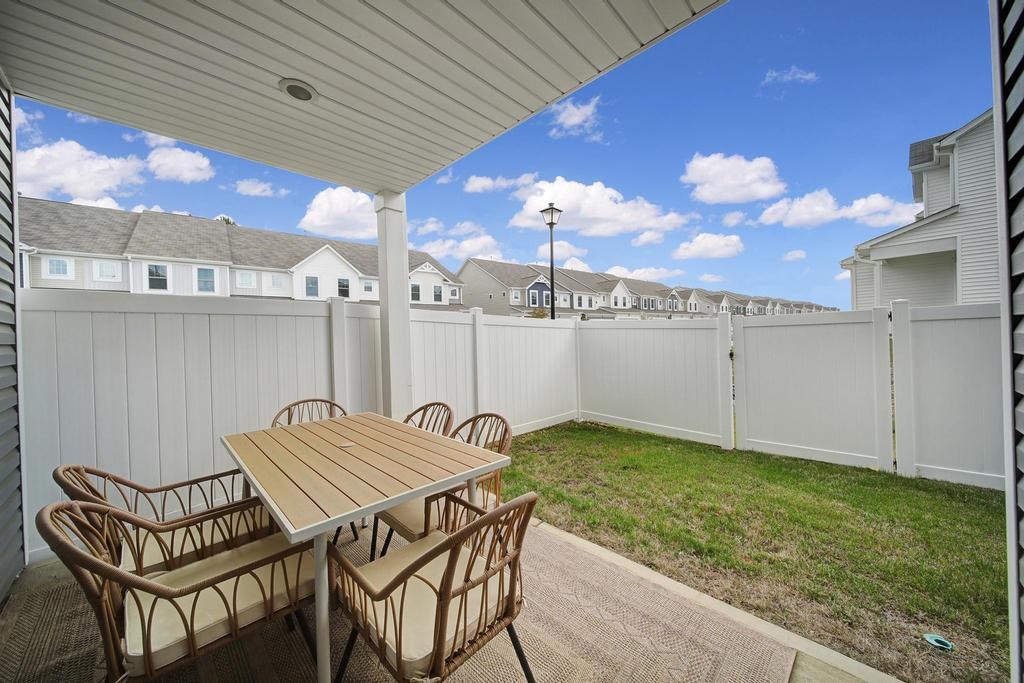 A patio with a table and chairs is shown.