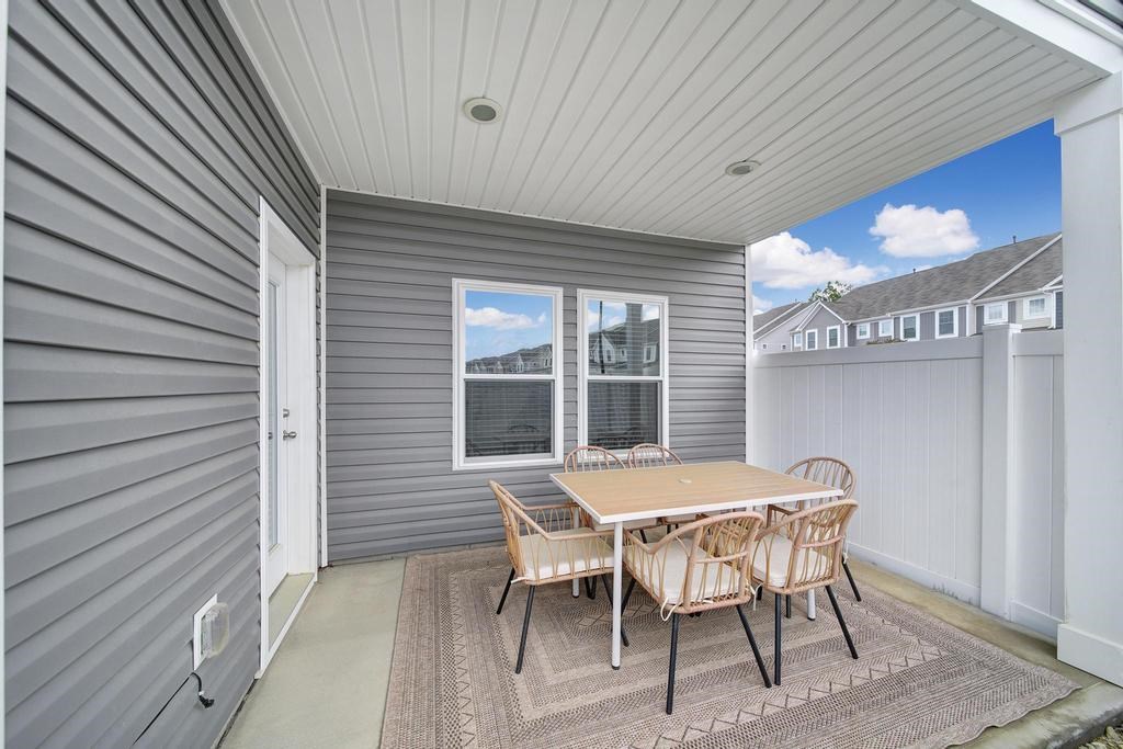 A patio with a table and chairs is shown.