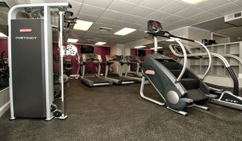 a gym with cardio machines and other exercise equipment