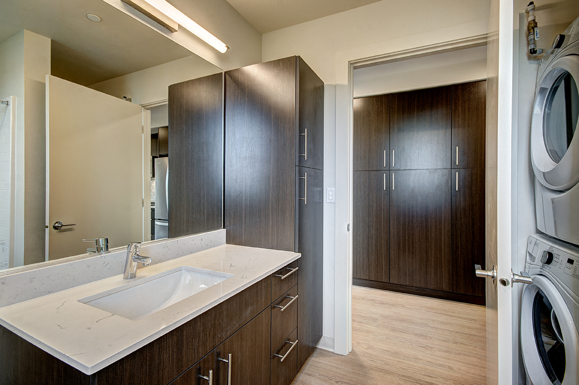 Modern bath with in home washer and dryer