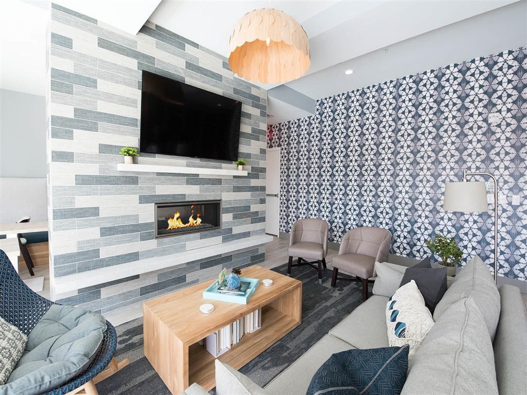 clubroom with couches and tv