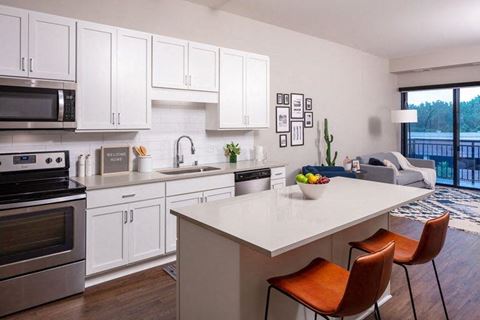 a kitchen with a white counter top