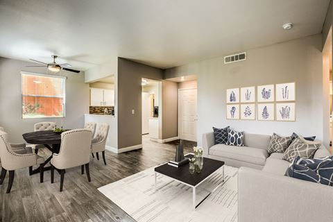 Madison at Black Mountain apartments photo of a living room with hardwood flooring and a space for a dining room table