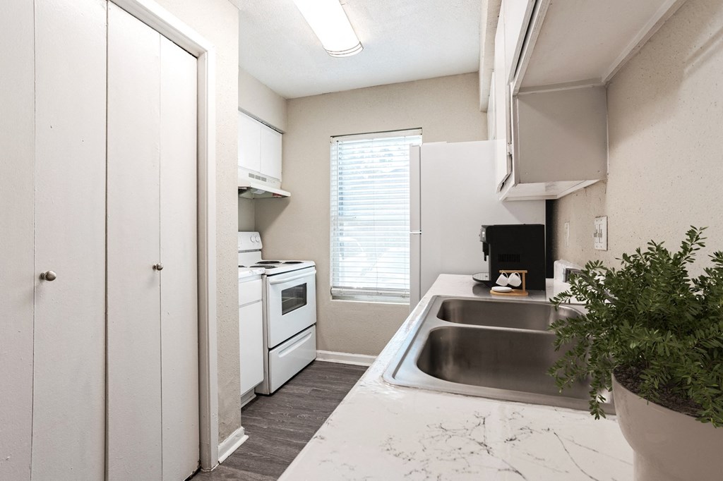 Large kitchen with window at Magnolia Terrace, a pet-friendly apartment community in Far West Houston, Houston, TX.
