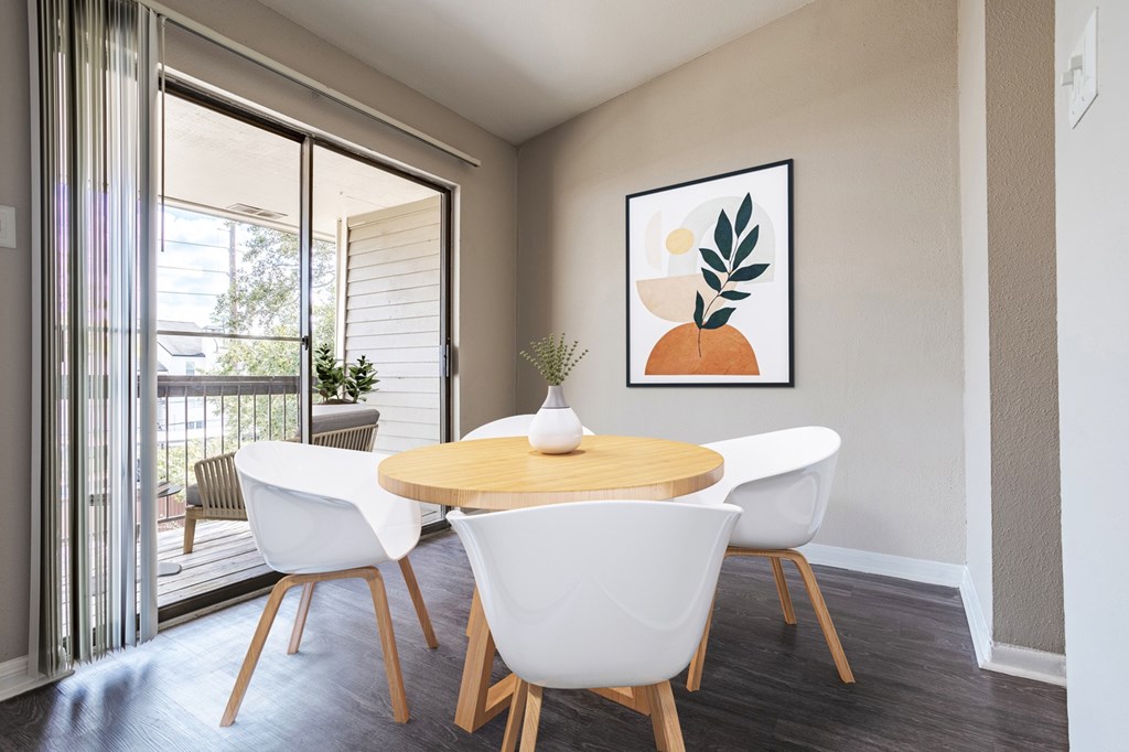 West Houston, TX Apartments – Magnolia Terrace – A dining room with a table and chairs.