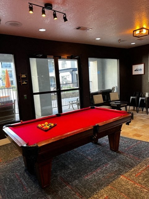 Apartments for Rent in North Little Rock, AR 72114– Metropolitan-   a red pool table in a room