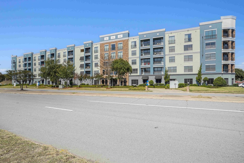 Pet-Friendly Rentals in North Little Rock, AR – Metropolitan – A row of apartment buildings with trees in front.
