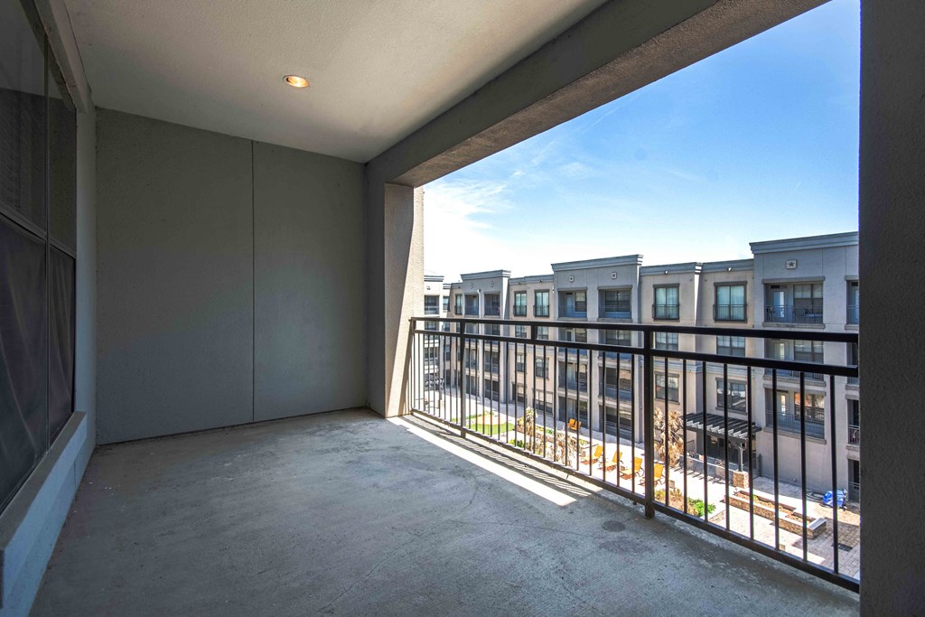 a balcony with a view of the street At Metropolitan Apartments in Little Rock, AR