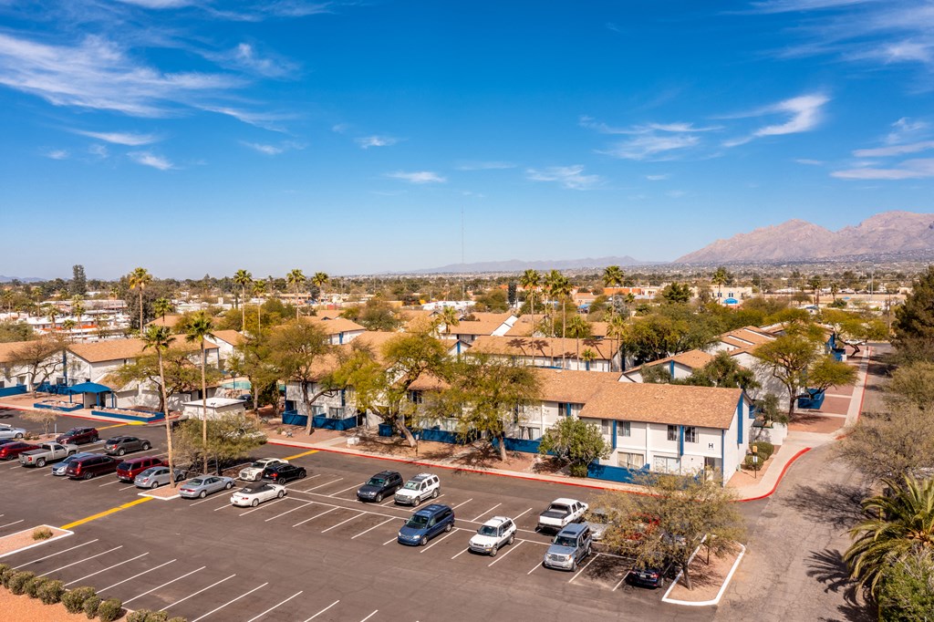 Property view with parking area at Midtown on Seneca, a pet-friendly apartment community near East Central Tucson, Tucson, AZ.