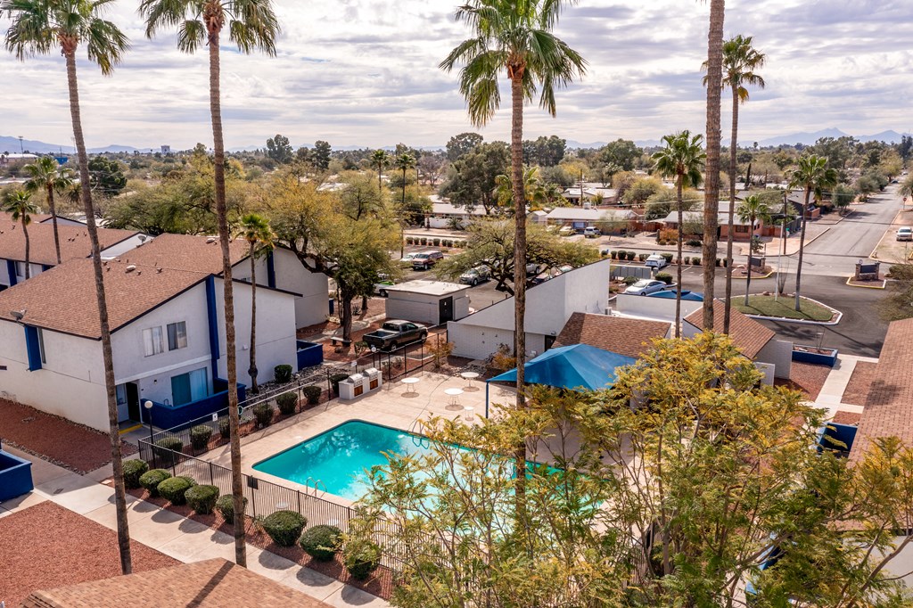 Aerial view of Midtown on Seneca community showing swimming pool and palm trees, a pet-friendly apartment community near East Central Tucson, Tucson, AZ.
