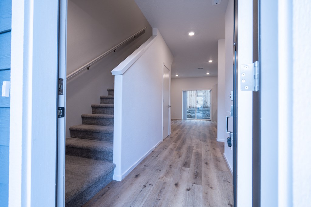 a view of the hallway from the front door