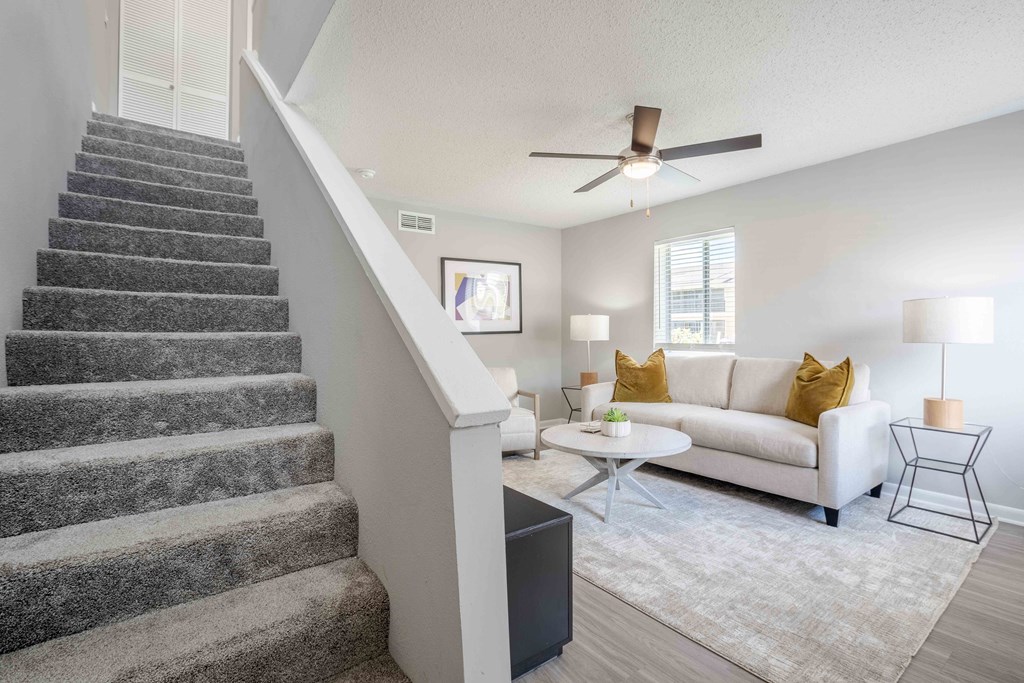 Kissimmee, Florida Apartments - Mirador at Woodside - Living Room Area with Staircase to Upstairs