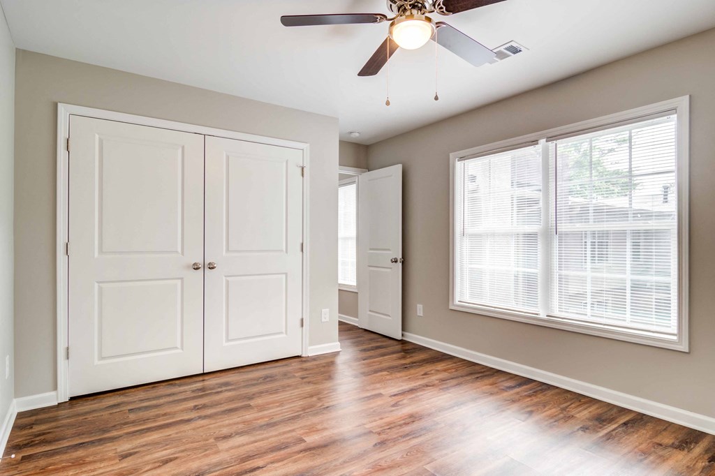 Mirador at Idlewood Apartments in Clarkston Georgia photo of bedroom with hardwood floors and large windows