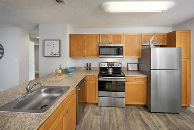 Sunny Lake apartments in Lauderhill Florida photo of kitchen with stainless steel appliances
