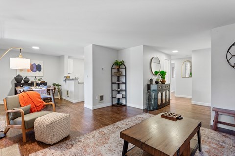 A living room with a brown table and a chair.