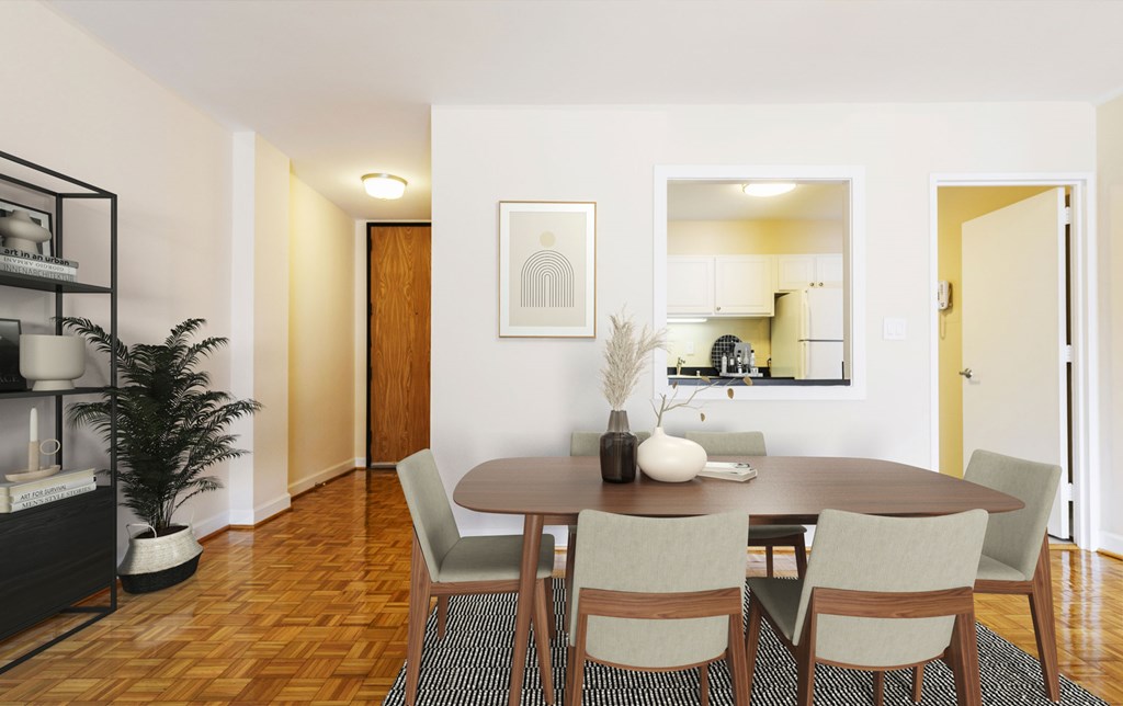 A dining room with a wooden table and chairs.