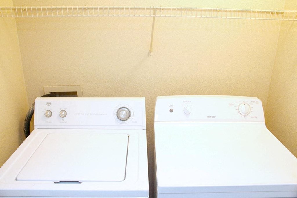a white washer and dryer next to each other