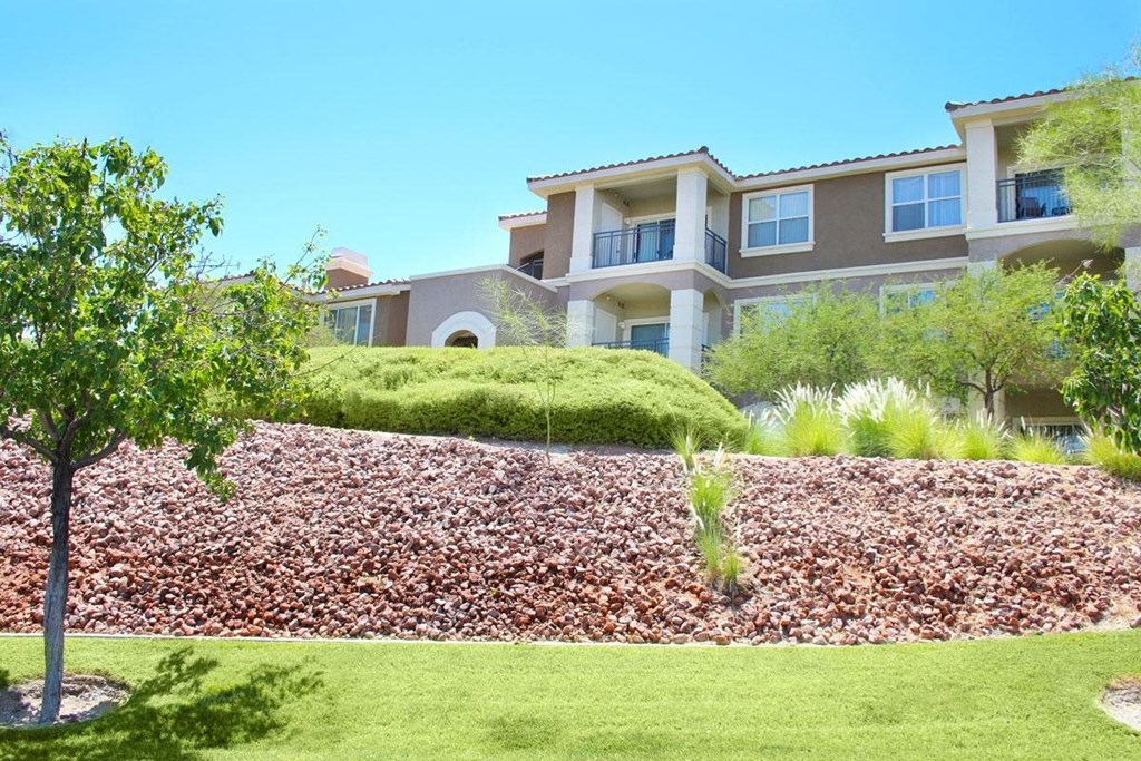 the front of a house with a landscaped yard