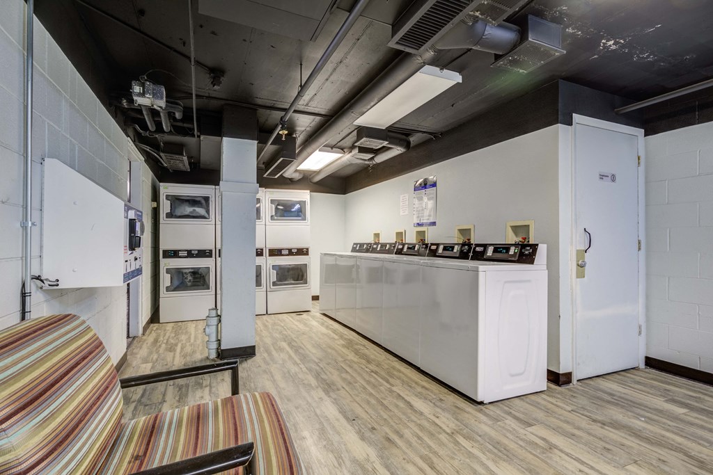 a room with a kitchen and a couch