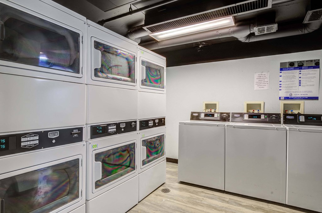 a row of microwaves in a room with other machines