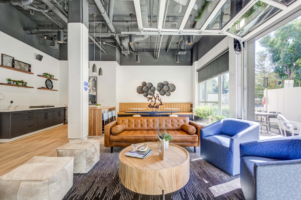 a living room with couches and chairs and a table