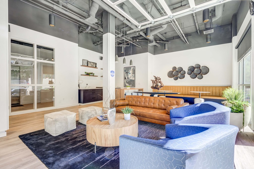 a living room with couches and chairs and a coffee table