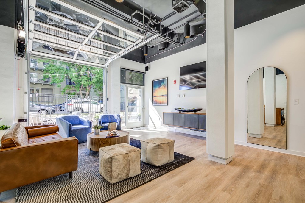a living room with furniture and a large window