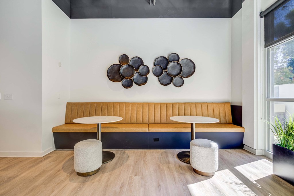 a living room with a couch and tables